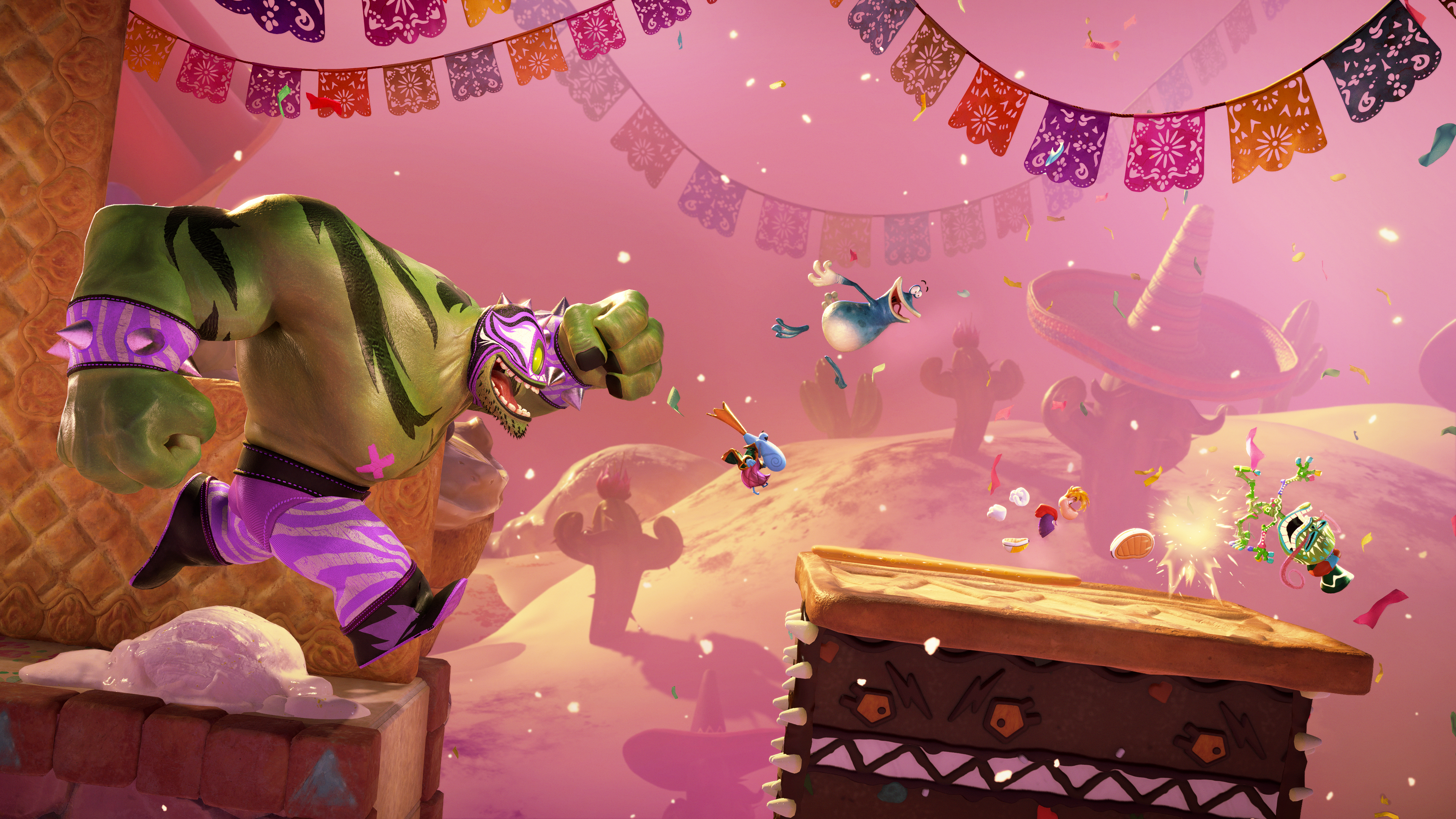 Capture d’écran de Rayman Legends Retold montrant une scène colorée dans un décor festif inspiré du Mexique, avec guirlandes, confettis et cactus sur fond rose. Un grand ennemi catcheur vert surgit à gauche, tandis que Rayman, Globox et d’autres personnages bondissent au-dessus de plateformes dans une ambiance d’action cartoon.