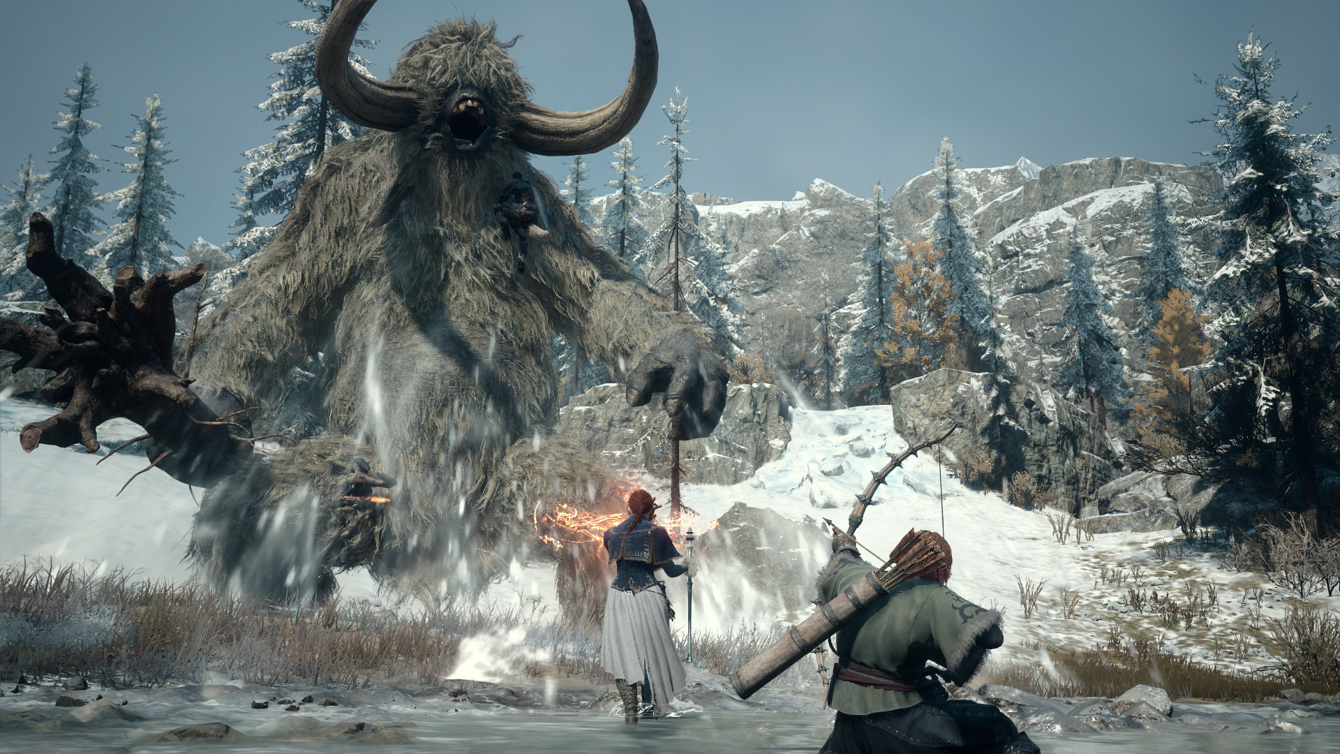 Capture d’écran de Dragon’s Dogma 2: Dark Arisen montrant deux aventuriers affrontant un immense monstre à fourrure grise et longues cornes dans une zone enneigée. La créature rugit au milieu des rafales de neige, tandis que les personnages se préparent au combat dans un décor montagneux et glacial.