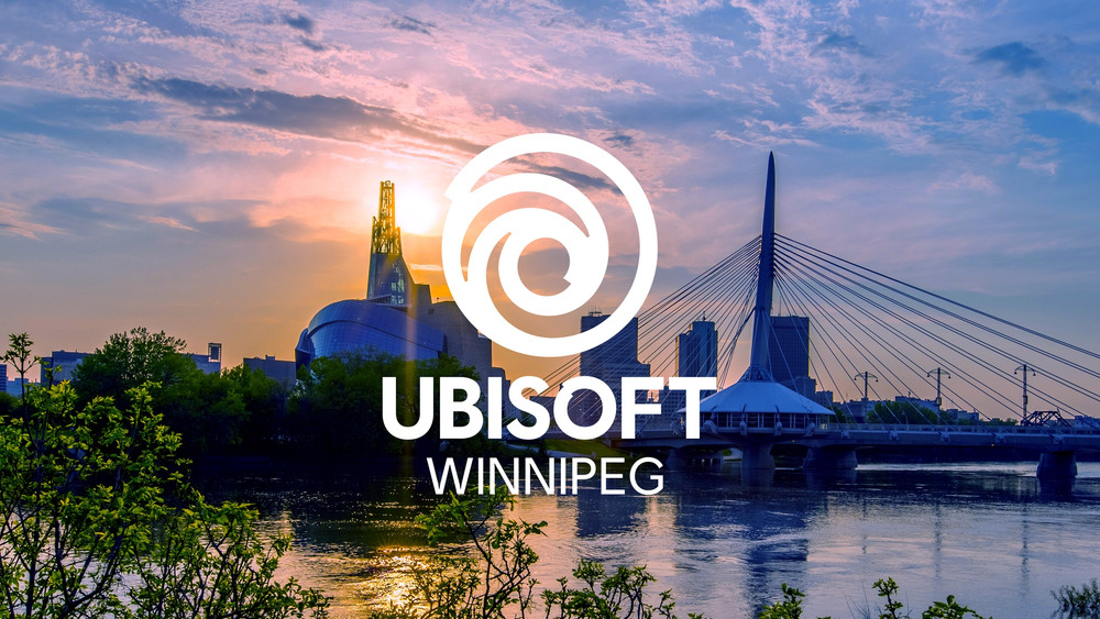 Visuel institutionnel d’Ubisoft Winnipeg avec le logo Ubisoft et le texte « Ubisoft Winnipeg » superposés à une vue du centre-ville de Winnipeg au coucher du soleil. Un pont à haubans traverse une rivière au premier plan, tandis que les bâtiments de la ville se détachent sur un ciel aux teintes roses, bleues et orangées.