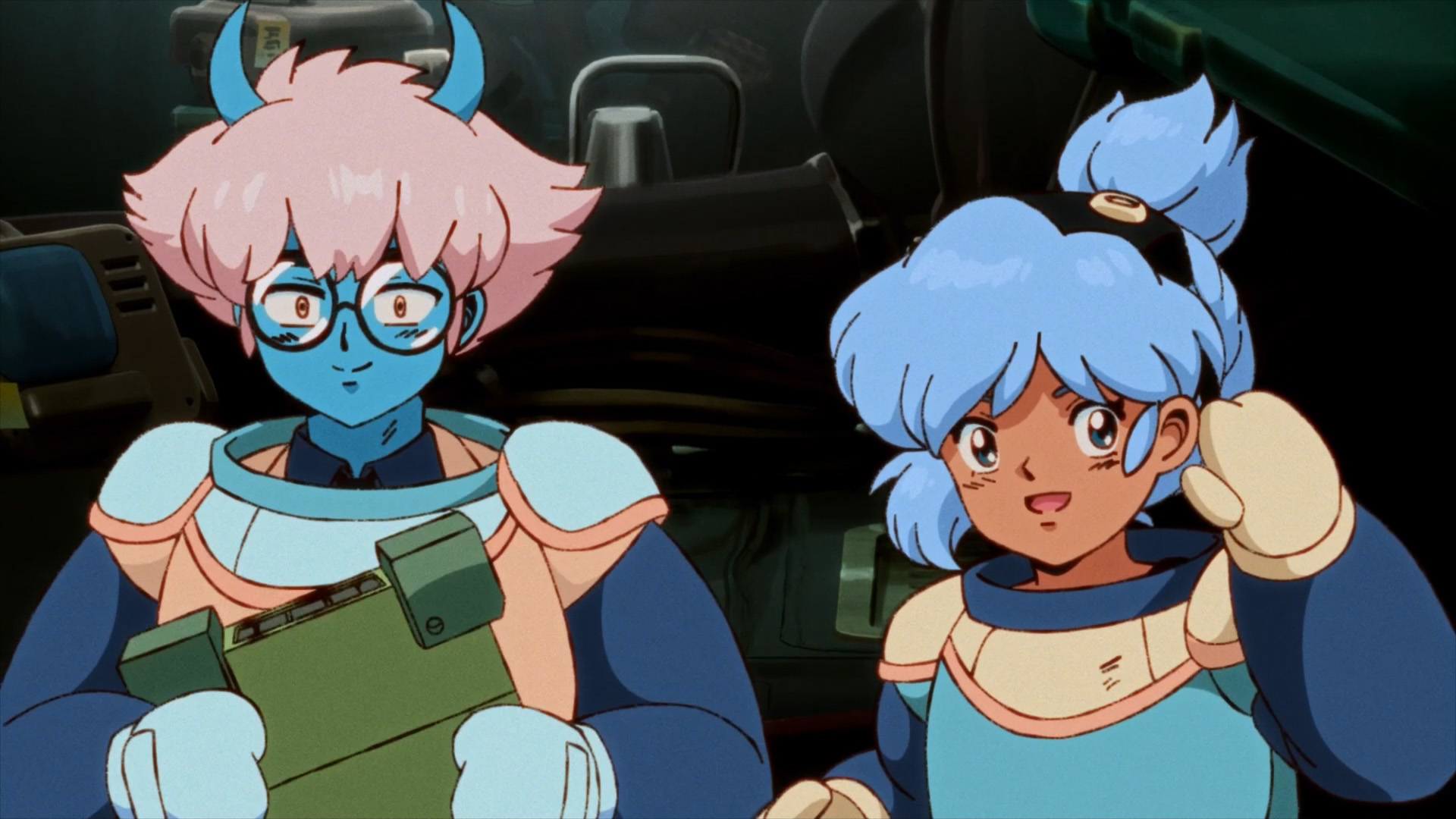 Capture d’écran d’Orbitals montrant deux personnages au style anime rétro dans un décor de cockpit ou de vaisseau spatial sombre. À gauche, un personnage bleu aux cheveux roses tient une tablette, tandis qu’à droite, une jeune fille aux cheveux bleus lève la main avec une expression enthousiaste.