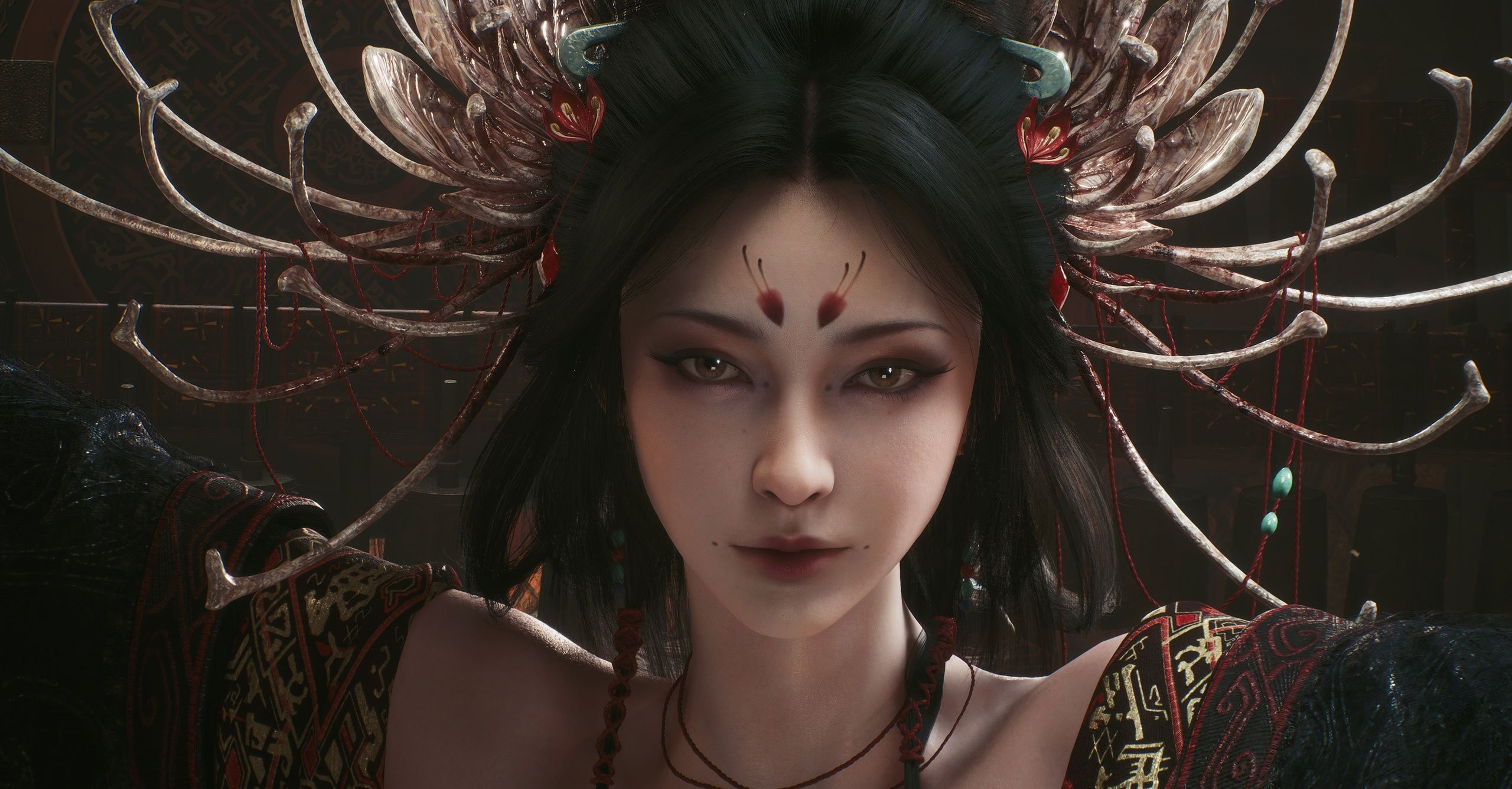 Illustration en 3D ultra-détaillée d’un personnage féminin au style fantastique et mystique, probablement issu d’un jeu vidéo narratif ou d’action-aventure. La femme est représentée en plan rapproché, avec un regard intense et pénétrant, dirigé droit vers le spectateur. Elle porte une tenue richement ornée de motifs traditionnels asiatiques, mêlant rouge, noir et or. Son visage pâle et parfaitement symétrique est orné de marques rouges au niveau du front et de petits grains de beauté près des lèvres, accentuant son aura mystérieuse. Ses cheveux noirs sont coiffés en arrière et entourés d’un imposant ornement en forme de fleur ou de couronne osseuse, décoré de fils rouges et de perles turquoise. L’arrière-plan, sombre et orné de motifs orientaux, met en valeur la mise en scène solennelle et presque surnaturelle du personnage, évoquant une figure de reine, de prêtresse ou de divinité.
