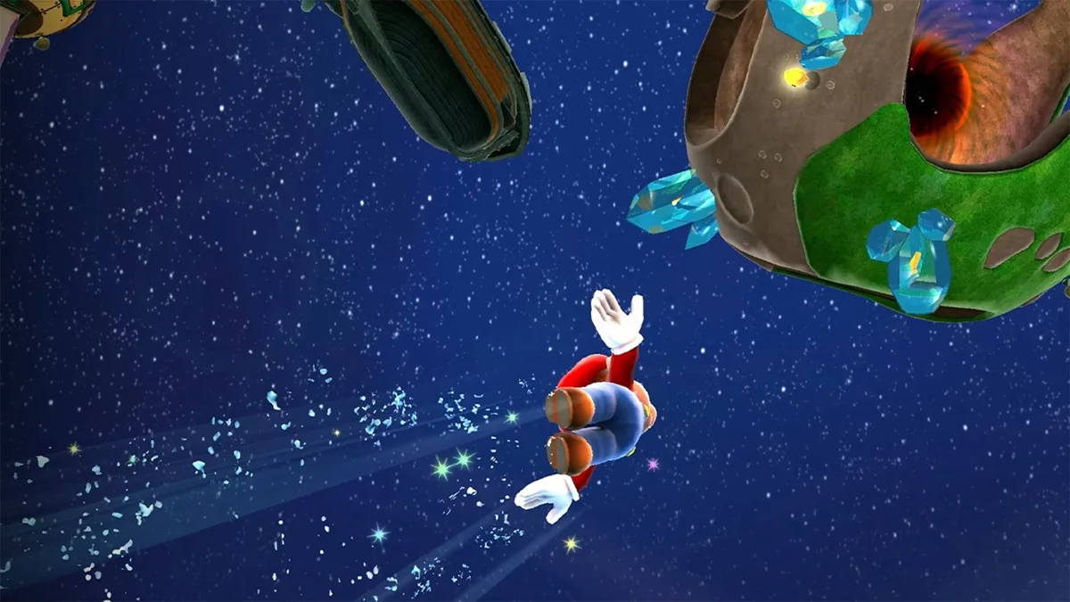 Capture d’écran du jeu Super Mario Galaxy. Mario, en tenue classique rouge et bleue, flotte dans l’espace étoilé en direction d’une petite planète sphérique recouverte de verdure et de cristaux bleus. Des traînées lumineuses suivent sa trajectoire, accentuant le mouvement spatial. D’autres objets célestes sont visibles autour, illustrant l’univers galactique du jeu.