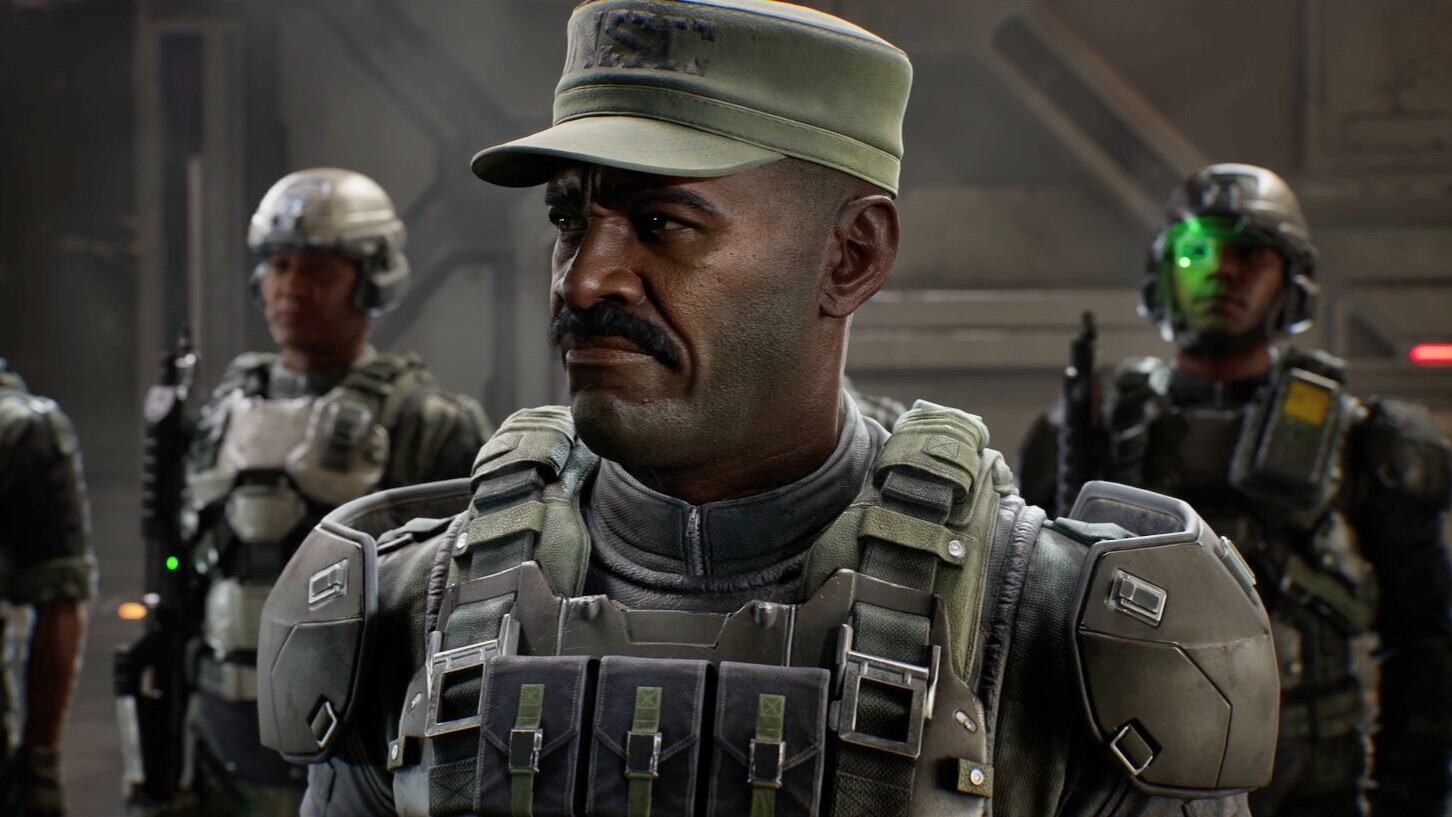 Capture de Halo montrant un officier militaire moustachu en uniforme et armure tactique, au premier plan dans un intérieur futuriste. Plusieurs soldats armés se tiennent derrière lui, dont un équipé d’une visière verte lumineuse.