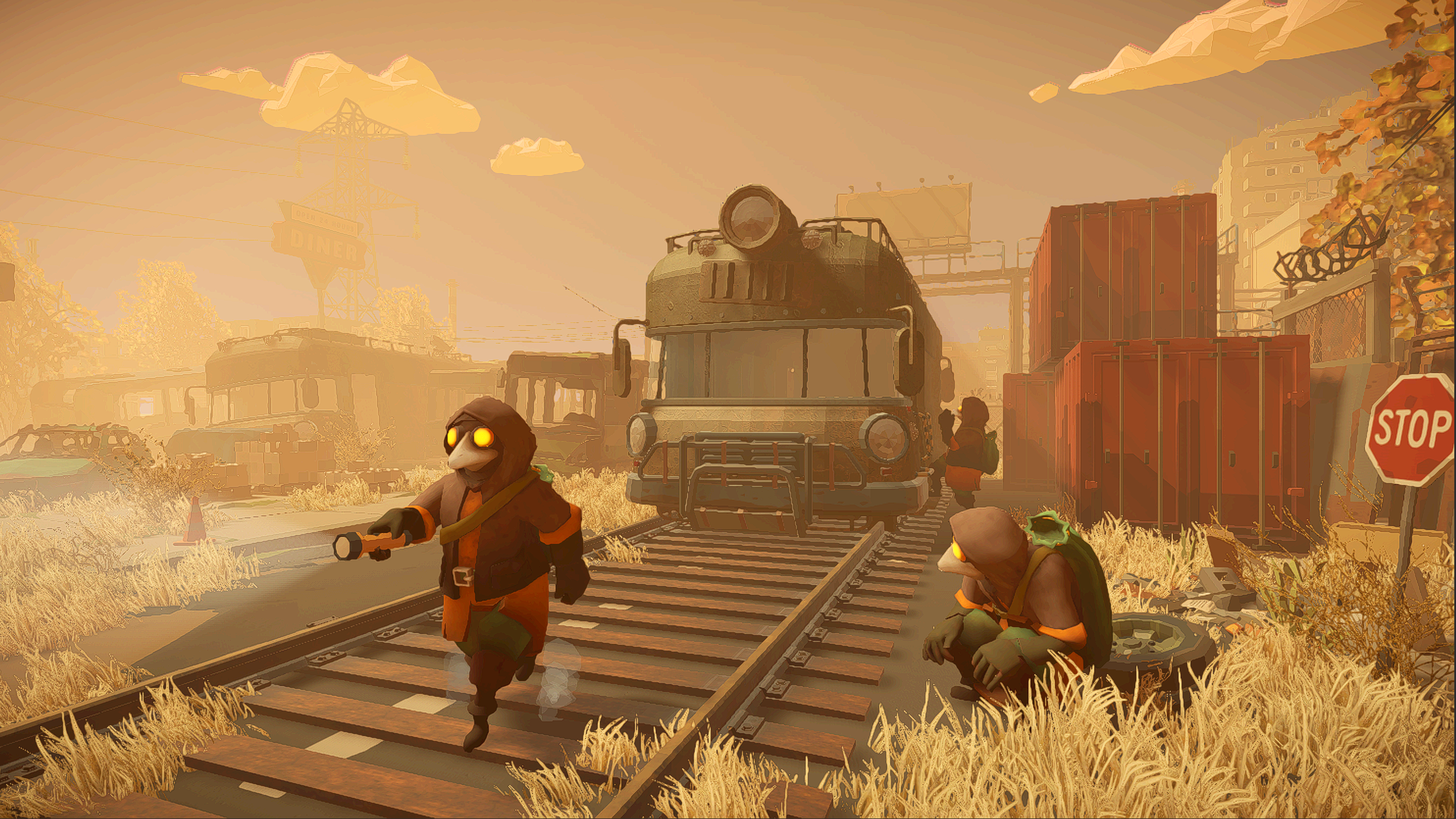 Visuel promotionnel de MIMESIS montrant plusieurs personnages encapuchonnés aux yeux jaunes lumineux explorant une zone postapocalyptique autour d’une locomotive arrêtée sur des rails. L’un avance avec une lampe torche tandis qu’un autre est accroupi près des voies, au milieu de conteneurs, bâtiments abandonnés et végétation desséchée baignés par une lumière orangée.