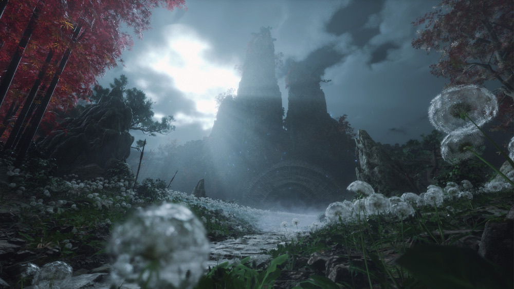 Image d’un environnement de jeu vidéo en 3D à l’ambiance mystérieuse et poétique, représentant une scène forestière dense et brumeuse sous une lumière lunaire dramatique. Le chemin en pierre, parsemé de pissenlits en graines, mène à une monumentale porte circulaire en ruine incrustée dans une falaise entre deux grandes colonnes rocheuses couvertes de végétation. Des arbres aux feuilles rouges flamboyantes bordent la scène à gauche et à droite, contrastant avec le ciel orageux et les teintes bleutées du reste de l’image. Un rayon de lumière céleste traverse l’ouverture nuageuse pour éclairer la porte ancienne, lui conférant une aura sacrée ou mystique. L’image est cadrée en contre-plongée avec des détails de la flore en avant-plan, renforçant l’effet d’immersion. Le tout évoque une atmosphère de fantasy sombre, de quête oubliée ou de sanctuaire ancestral dans un monde visuellement proche des productions comme Ghost of Tsushima, Elden Ring ou Sekiro.